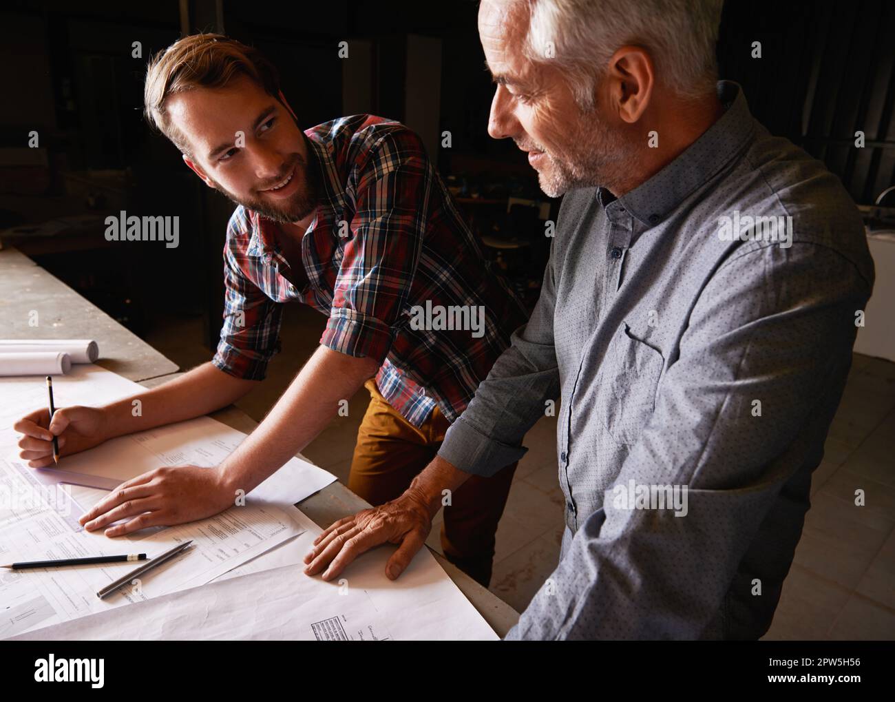 Turning his vision into reality. An architect drawing up plans Stock