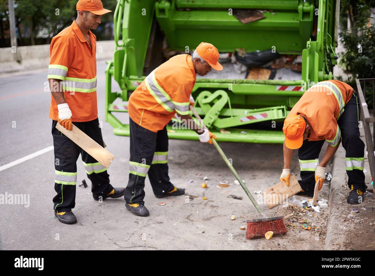 Garbage collection day. a garbage collection team at work Stock Photo