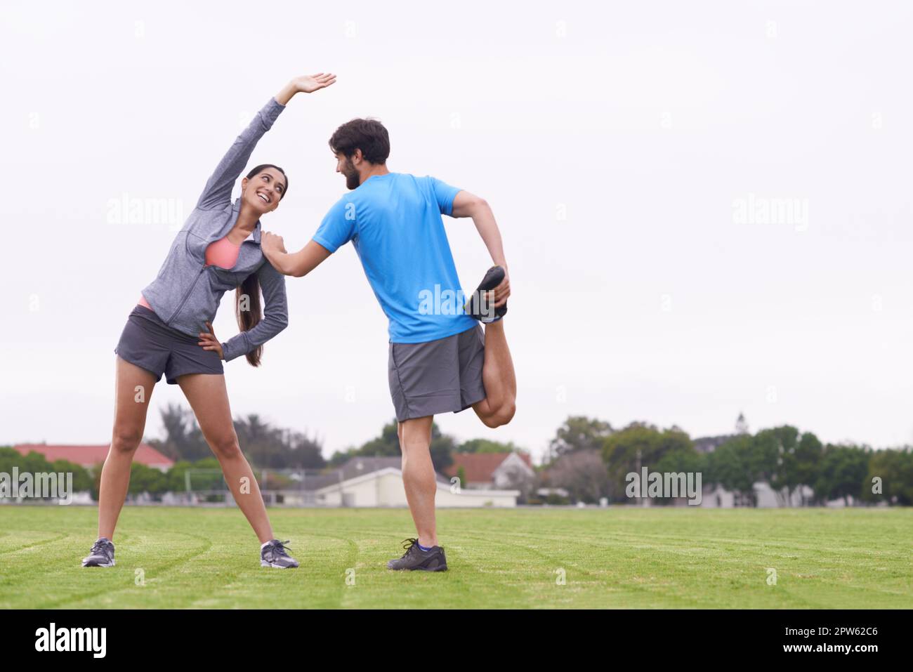 Helping each other stretch hi-res stock photography and images - Alamy