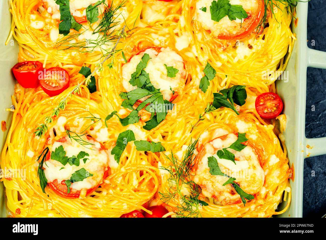 Spaghetti nests baked with meatballs and cheese. Casserole Stock Photo Alamy