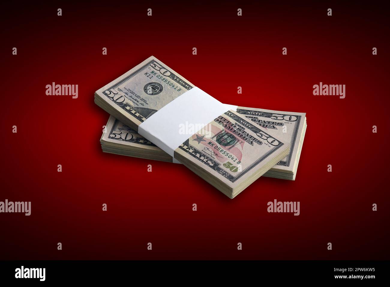 Bundle of US dollar bills on crimson red background. Pack of american ...