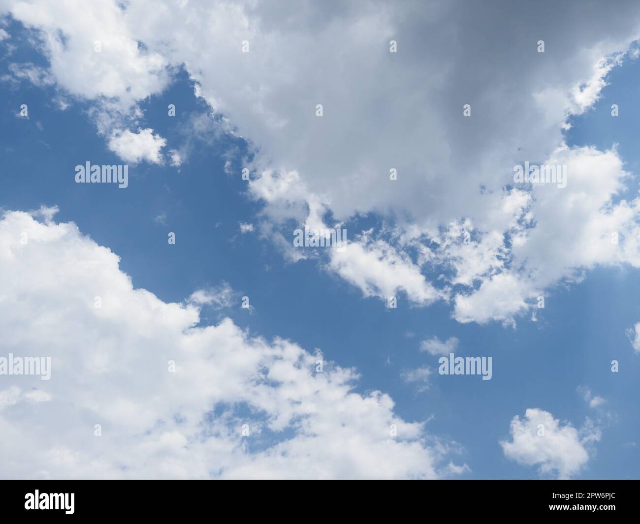 blue sky with clouds useful as a background Stock Photo - Alamy