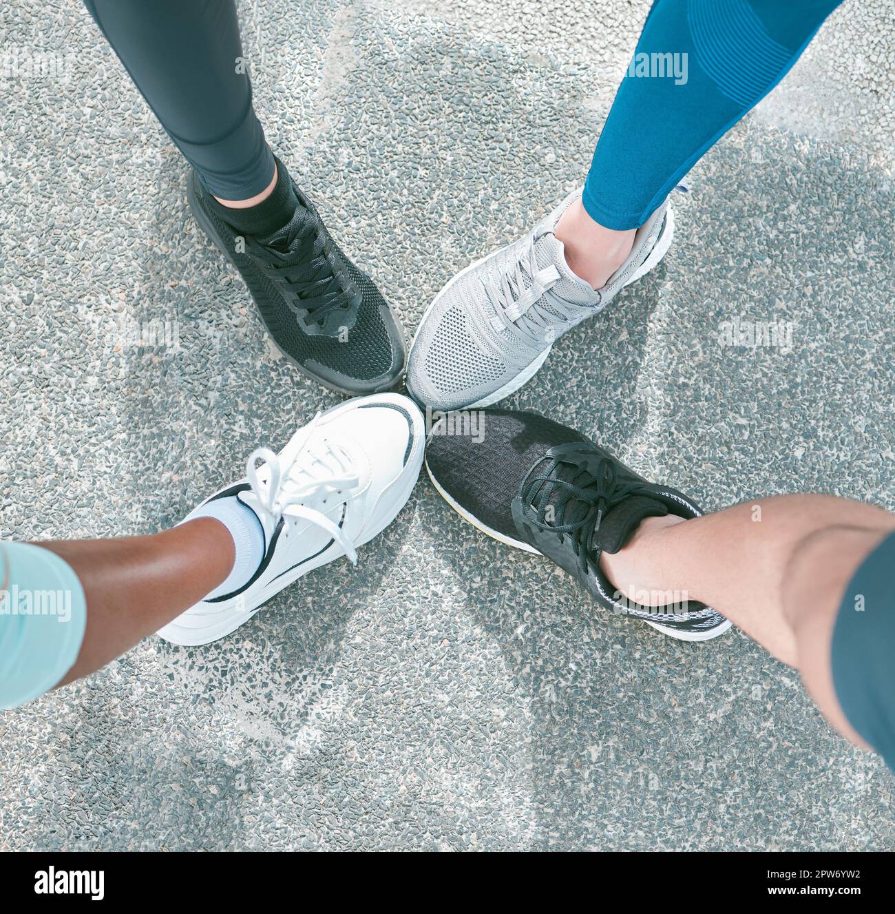 Closeup of diverse group of athletes from above wearing sports sneaker ...