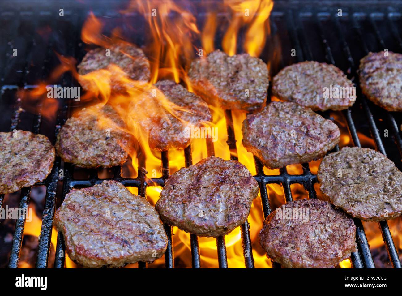 Using bbq fire flame grill for grilling of grilled beef meat barbecue ...