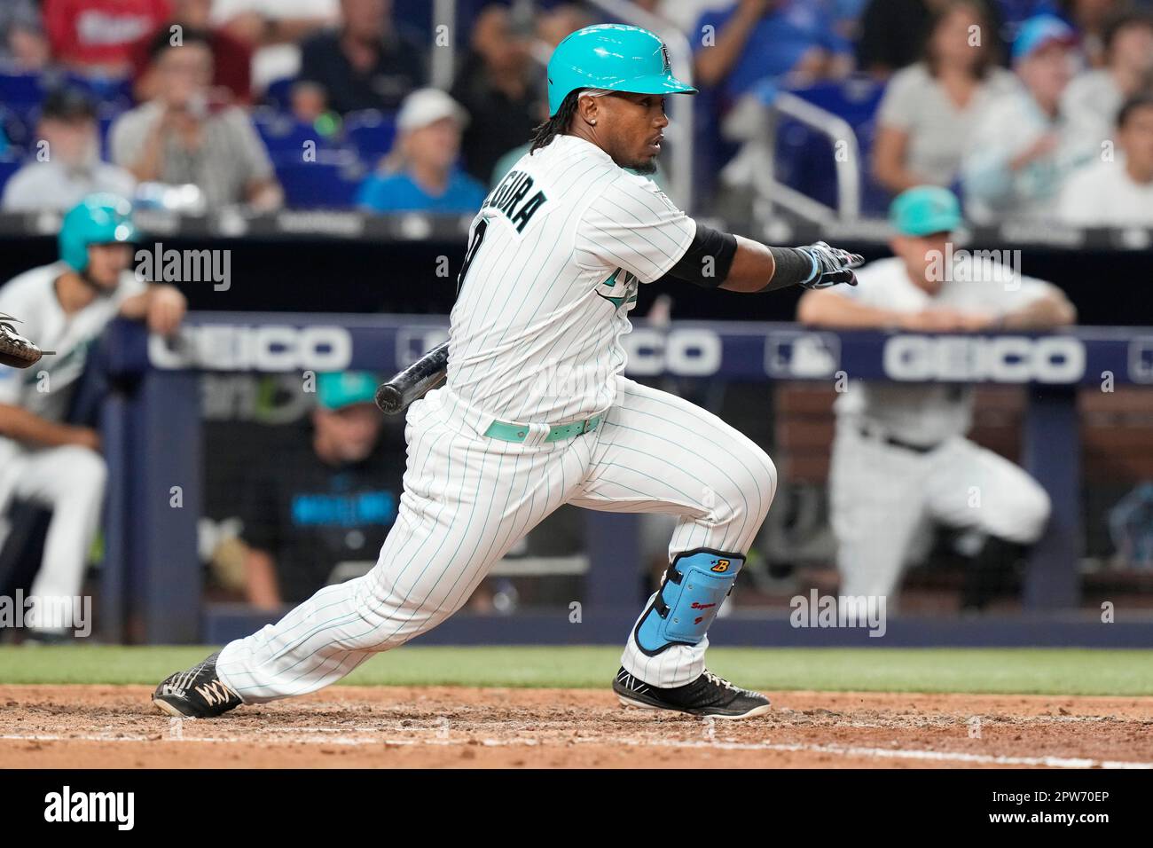 Miami Marlins' Jean Segura (9) hits a single to score the winning