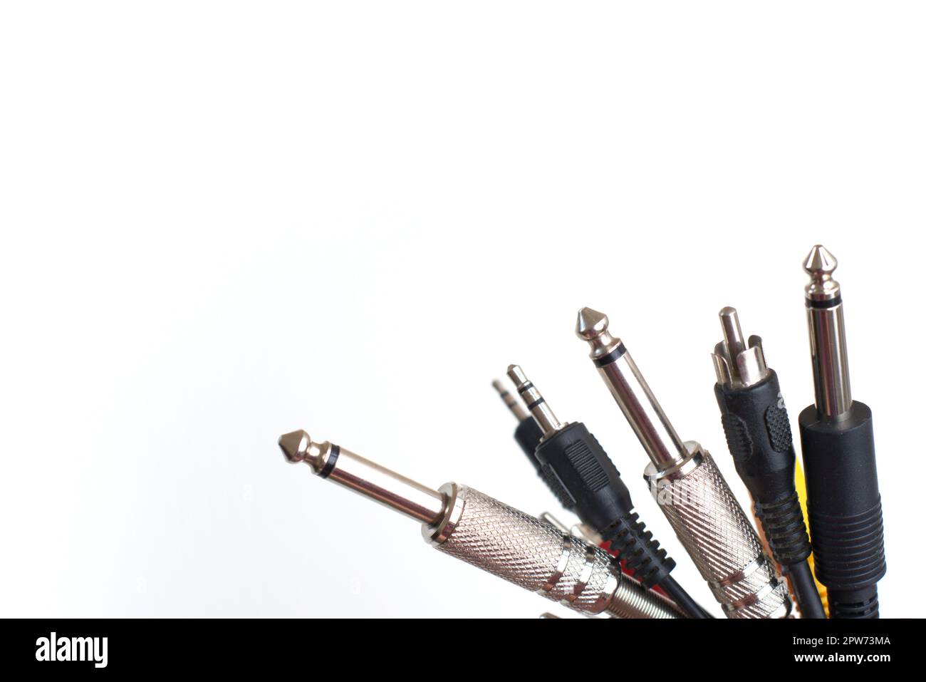 Audio cables and connectors on white background. Recording studio, music industry, sound