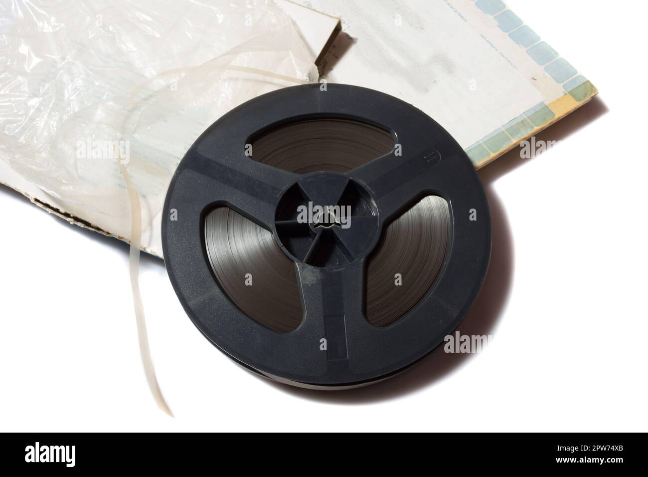 reel-to-reel tape spool with carton box on white background Stock Photo ...