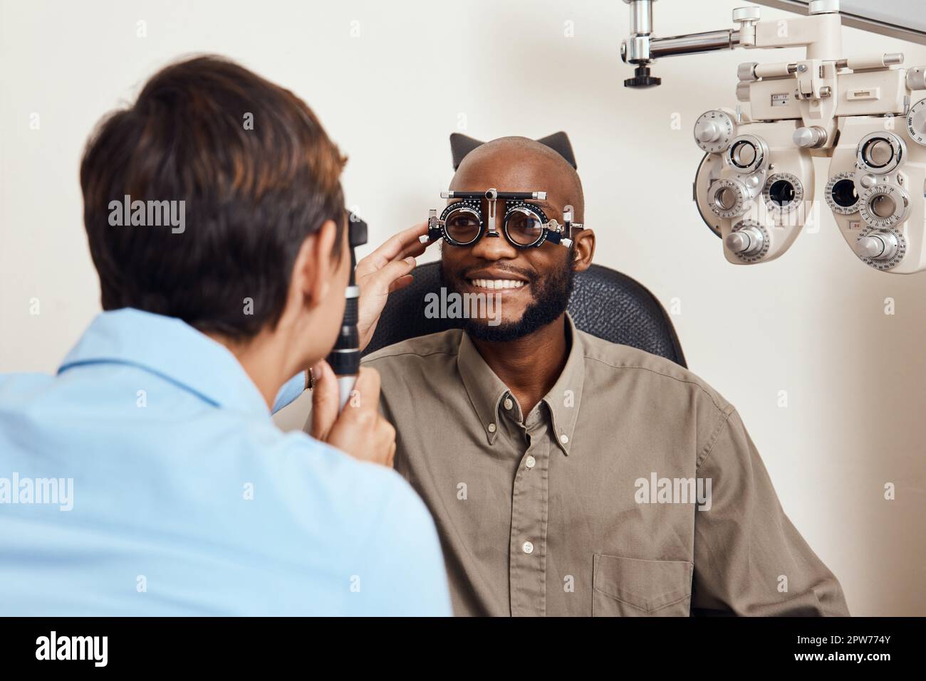 Optical exam, optician or eye doctor at work testing vision or sight of