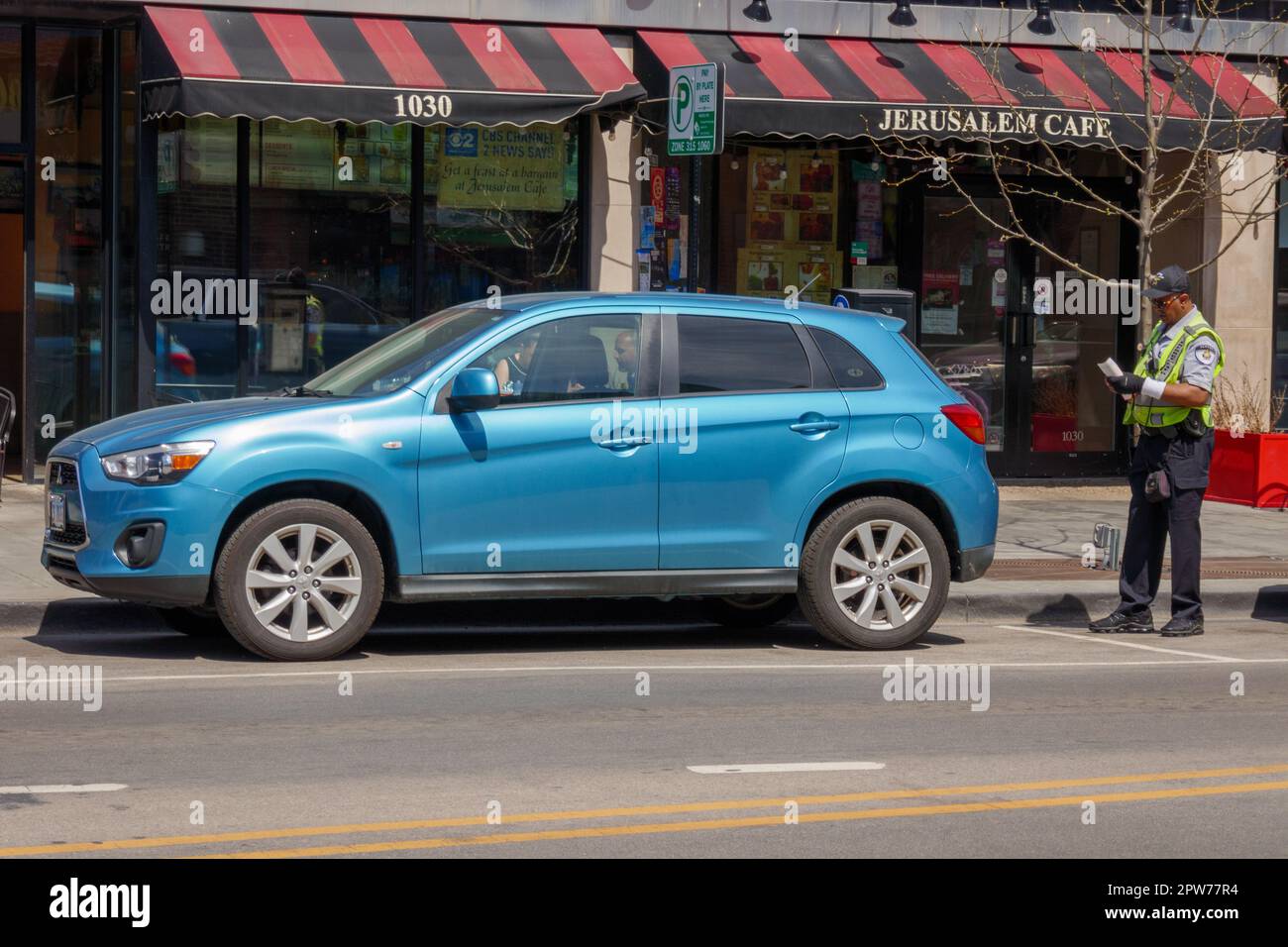Parking enforcement officer writing ticket. Oak Park, Illinois Stock Photo Alamy