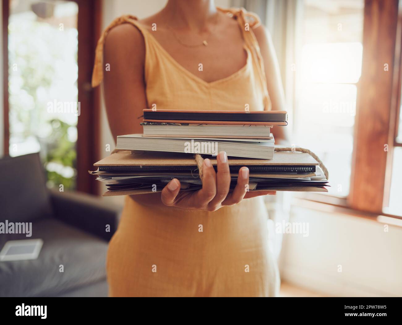Recycle, books and notebook with woman cleaning or donating paper