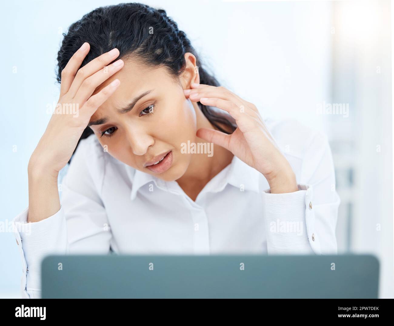 Where does my attention go. a young businesswoman looking overwhelmed