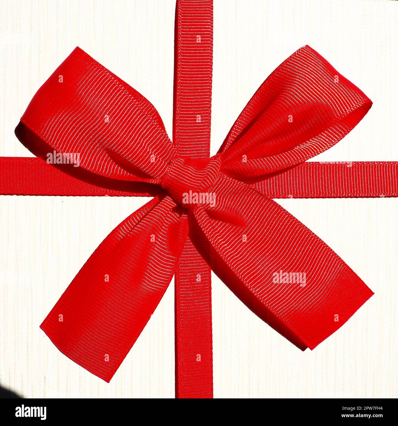 White gift box with red ribbon bow isolated on white background Stock ...