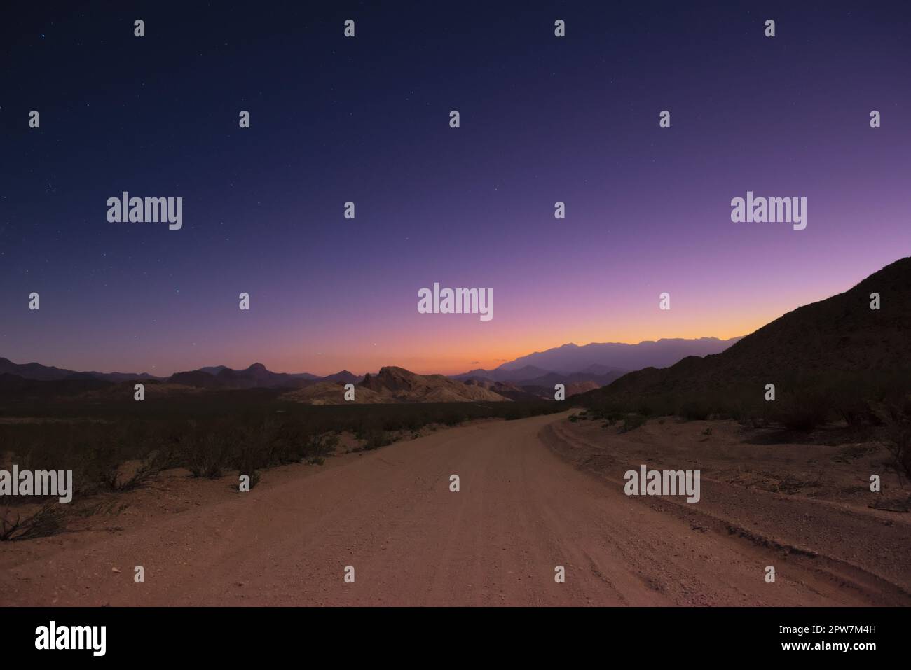 Dirt road under the dark sky hi-res stock photography and images - Alamy