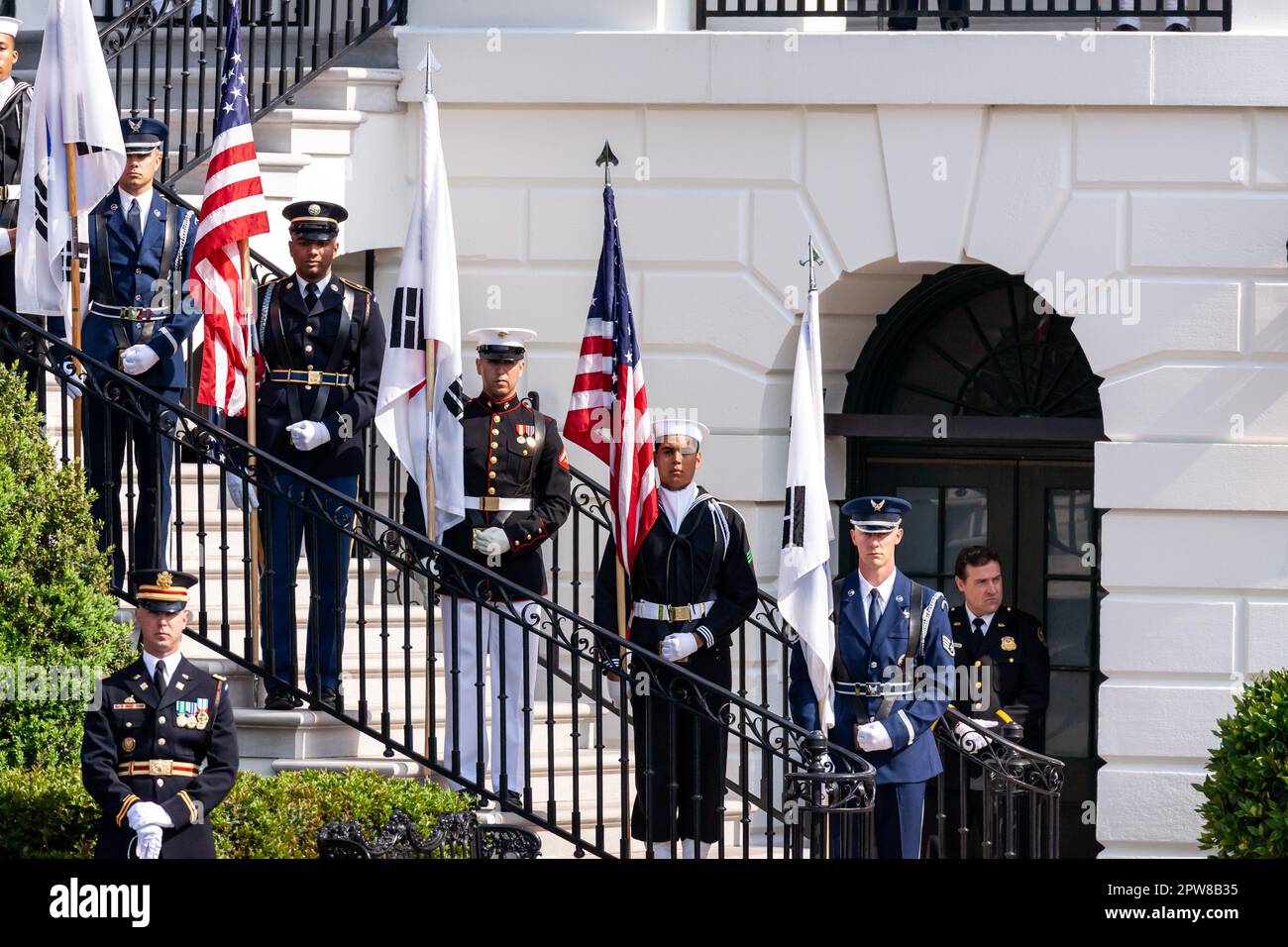 Washington, United States. 26th Apr, 2023. Military ceremonial guards display American and South Korean flags on the White House stairs on President Yoon Suk Yeol and First Lady Kim Keon-hee's state visit. The two leaders will discuss the alliance between the US and South Korea, and how it may be used to further interests in east Asia. A joint press conference and a state dinner will follow. Credit: SOPA Images Limited/Alamy Live News Stock Photo