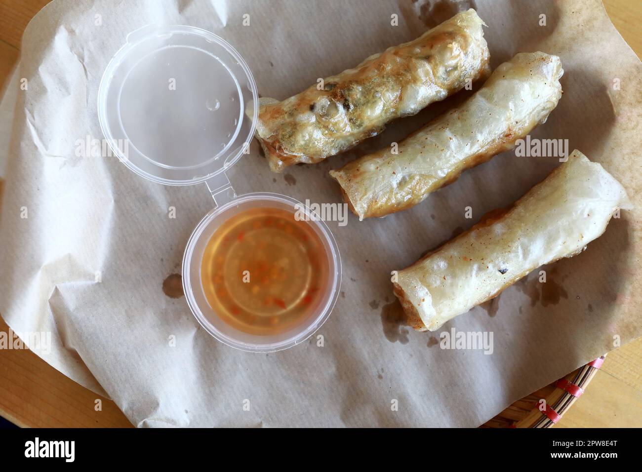 Spring rolls with sauce in Vietnamese restaurant Stock Photo