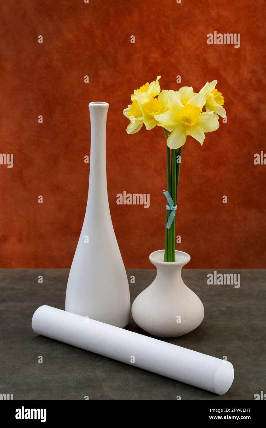 Still life with a bouquet of daffodils in a white vase Stock Photo - Alamy