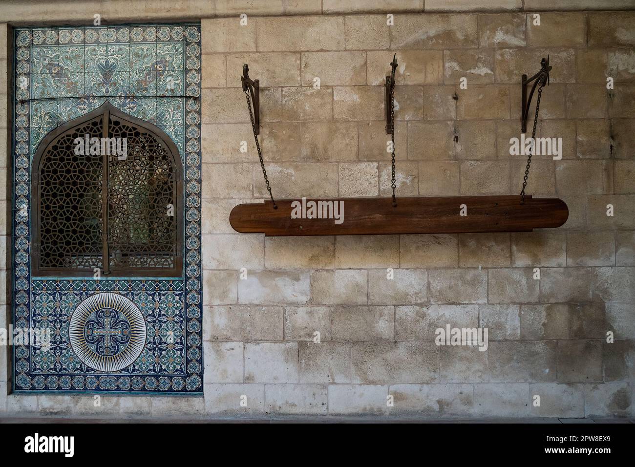 Sematron Instrument Jerusalem, Israel - November 12th, 2022: A semantron and armenian tile ...
