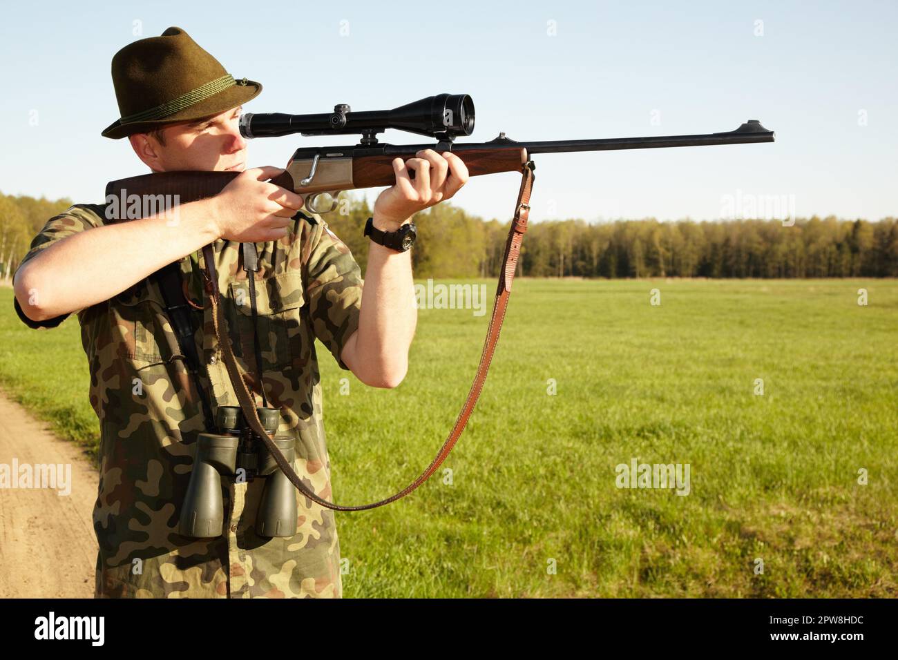 Hunter, gun and man in nature on a Africa safari for animal ...
