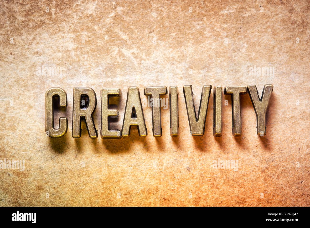creativity word made from metallic letters on grunge background Stock Photo