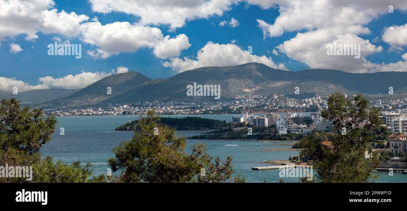 Greece, destination city of Chalkida at Evia island. View of seafront Halkida from Karababa castle, building, Euripus Strait, cloudy sky background. Stock Photo