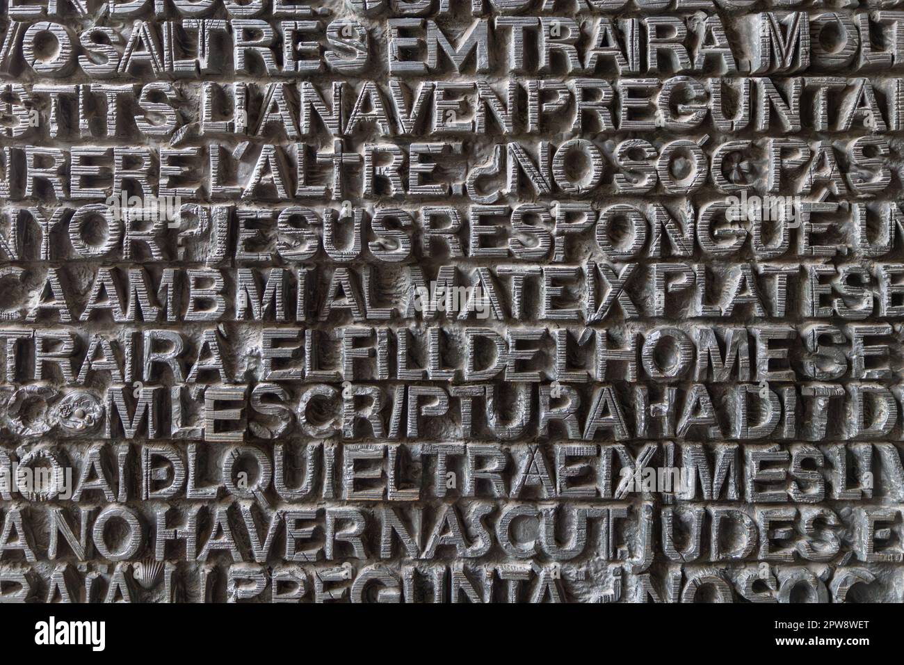 metallic ancient latin letters background texture (illegible inscriptions) Stock Photo