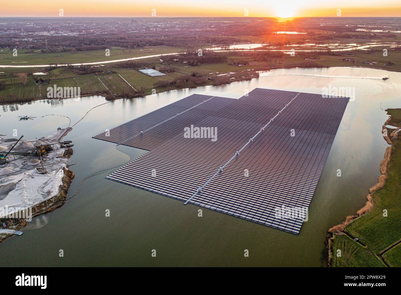 The Netherlands, Haerst near Zwolle, Floating solar panels in lake Bomhofsplas. Aerial view. Stock Photo