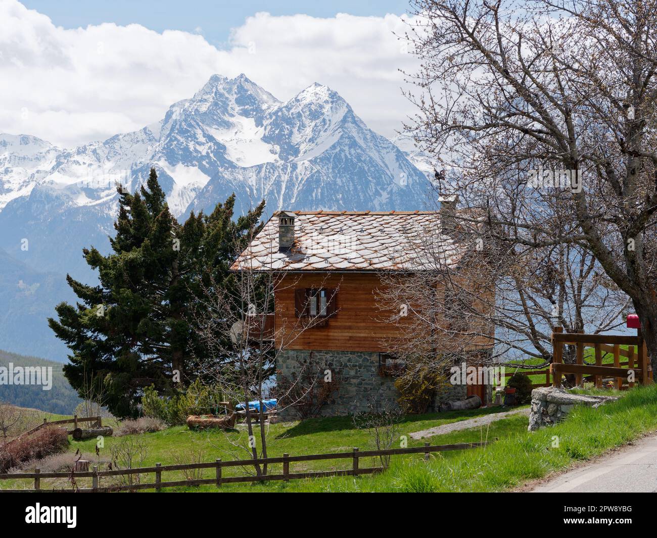 Traditional wood and stone built house in the alpine town of Lignan in the Aosta Vally, NW Italy Stock Photo