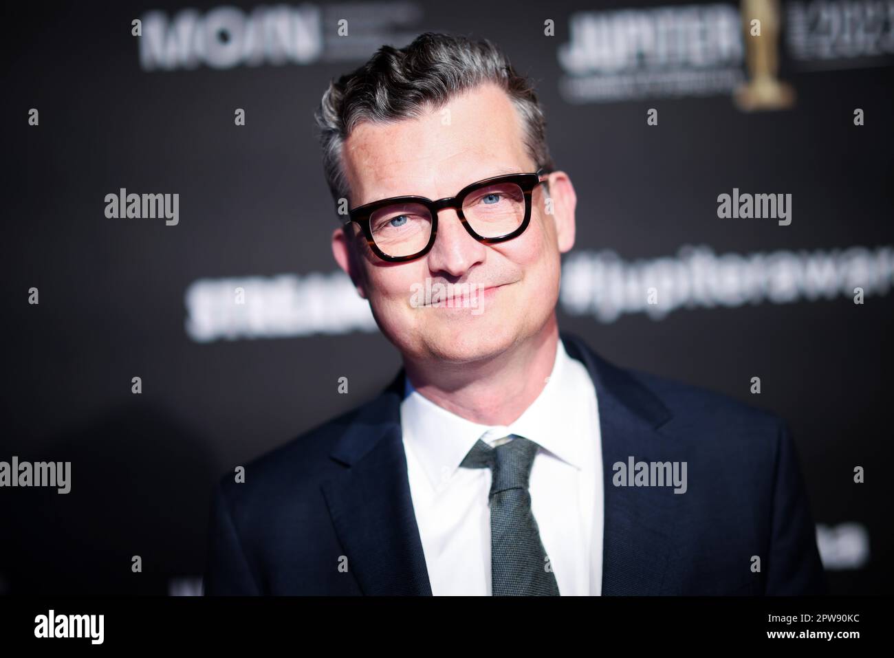 27 April 2023, Hamburg: Malte Grunert, film producer, arrives for the presentation of the Jupiter Award 2023. For the 45th time, the magazines 'TV Spielfilm' and 'Cinema' awarded the audience prize for outstanding film productions and brilliant acting performances. Photo: Christian Charisius/dpa Stock Photo