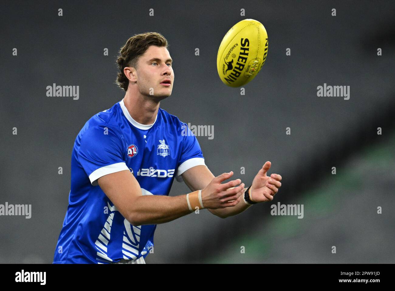 Comben Charlie Comben of North Melbourne warms up during the AFL Round 7 match ...