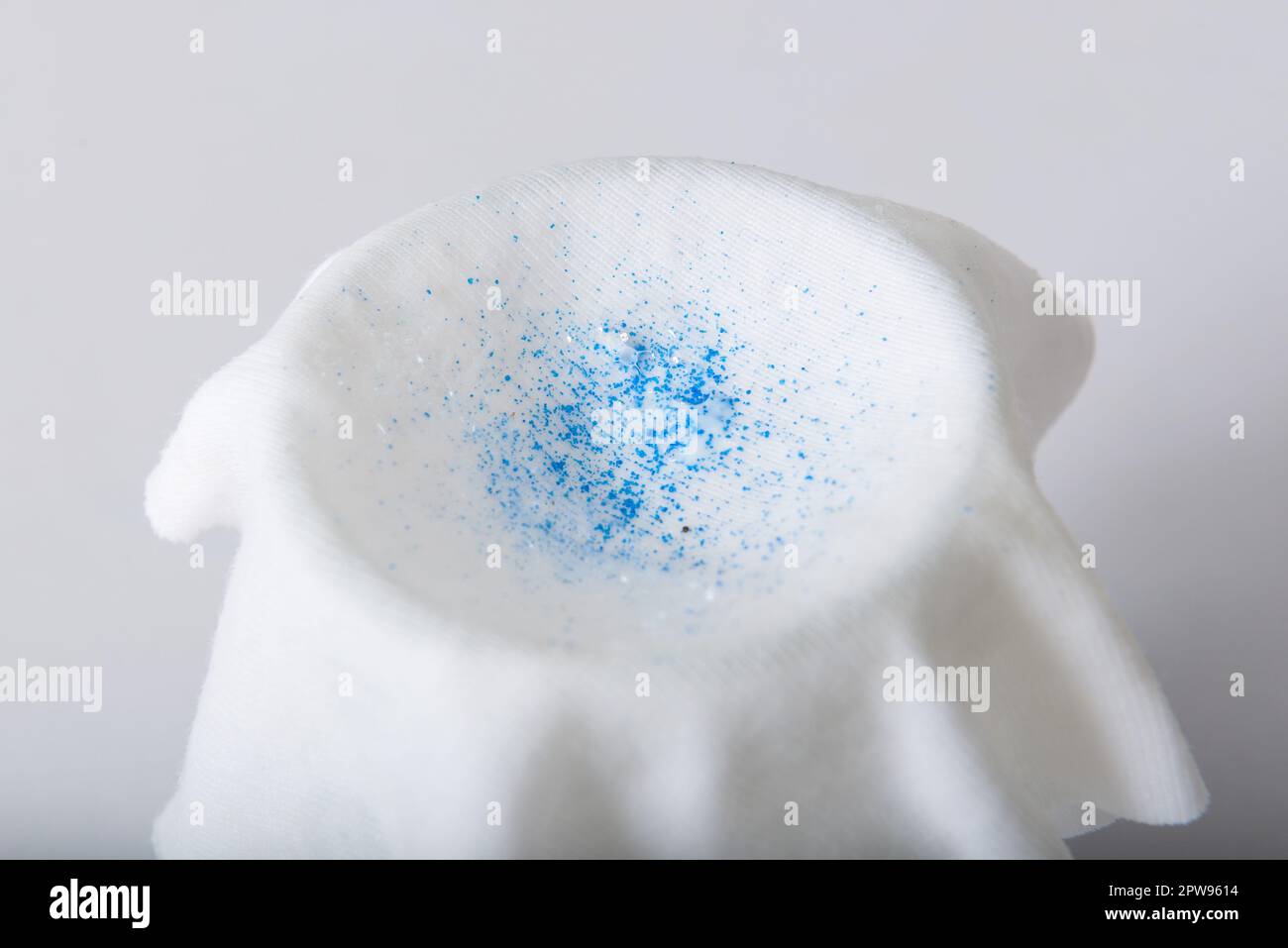 TAMIL NADU, INDIA - March 2023: Microplastics found filtering little drops of cosmetic products mixed with water. Stock Photo