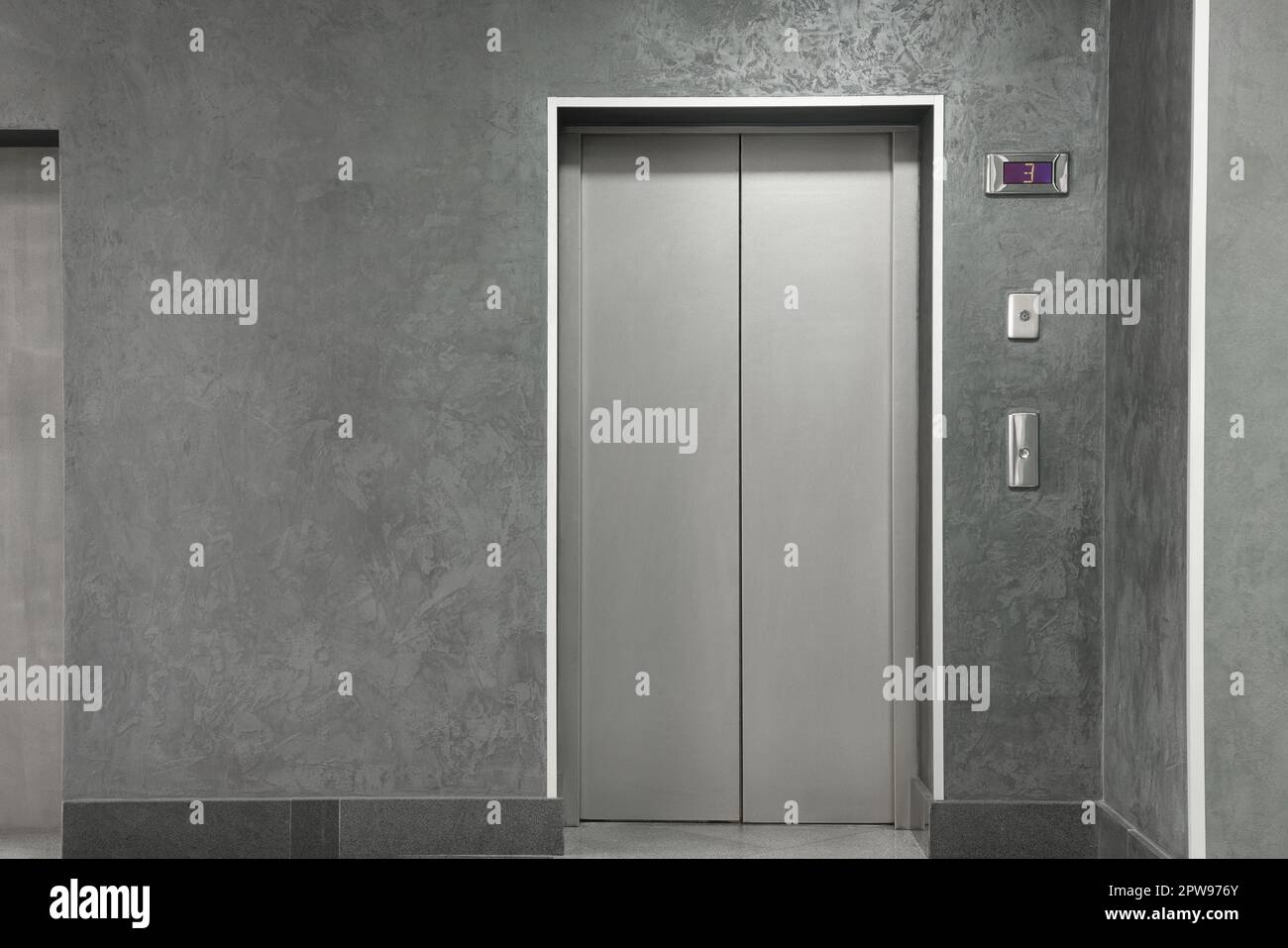Closed stylish elevator door in clean hall Stock Photo Alamy