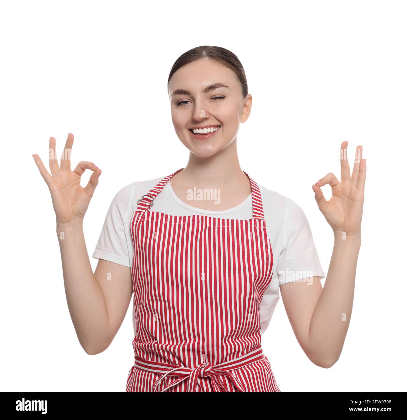 Beautiful young woman in clean striped apron on white background Stock ...