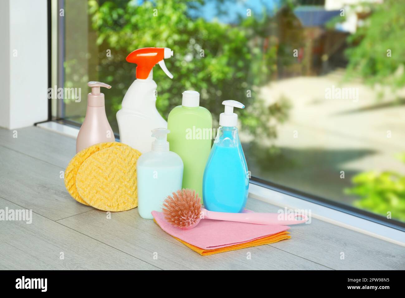 https://c8.alamy.com/comp/2PW98N5/different-cleaning-supplies-and-tools-on-window-sill-indoors-2PW98N5.jpg