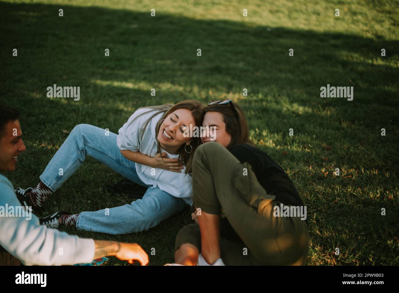 Two friends laugh while enjoying nature Stock Photo - Alamy