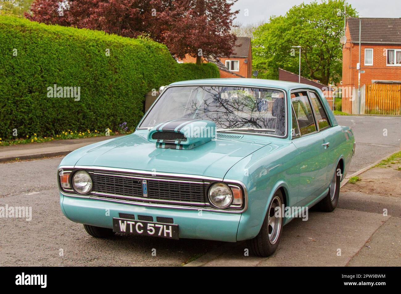 1970 70s seventies custom Ford Cortina Blue 3500 cc V8 Turbo, Ford Cortina Super Mark II two-door saloon parked in Leyland, UK Stock Photo
