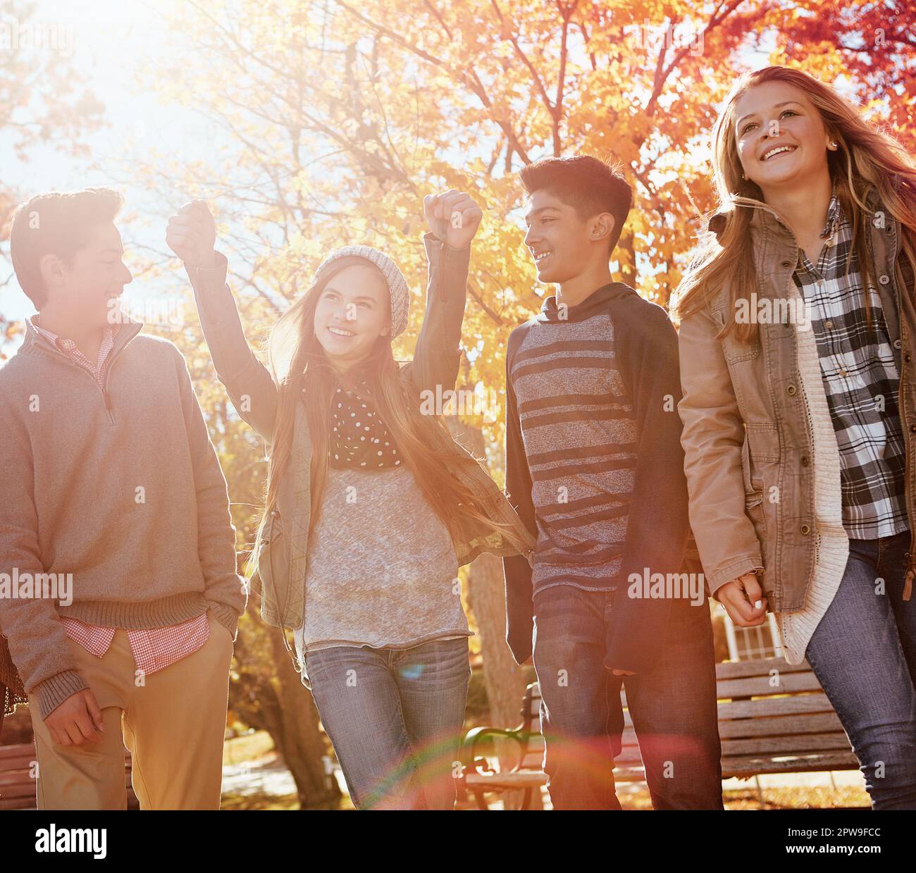 The fun just never stops. a group of teenage friends enjoying an autumn day outside together. Stock Photo