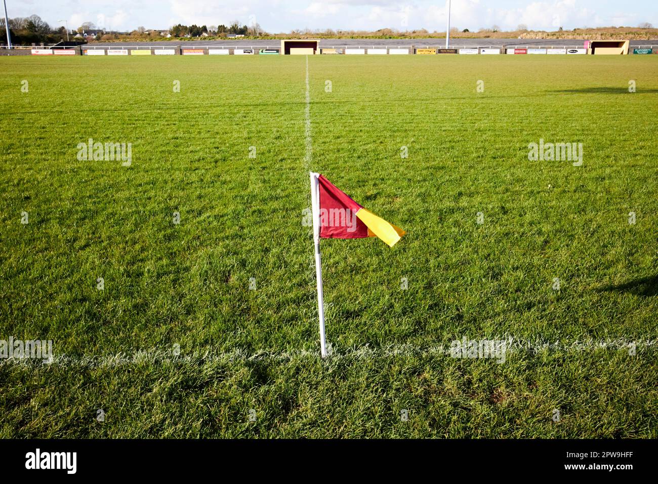 red and yellow flag marking 45m line local gaa pitch in ballinrobe county mayo republic of ireland Stock Photo