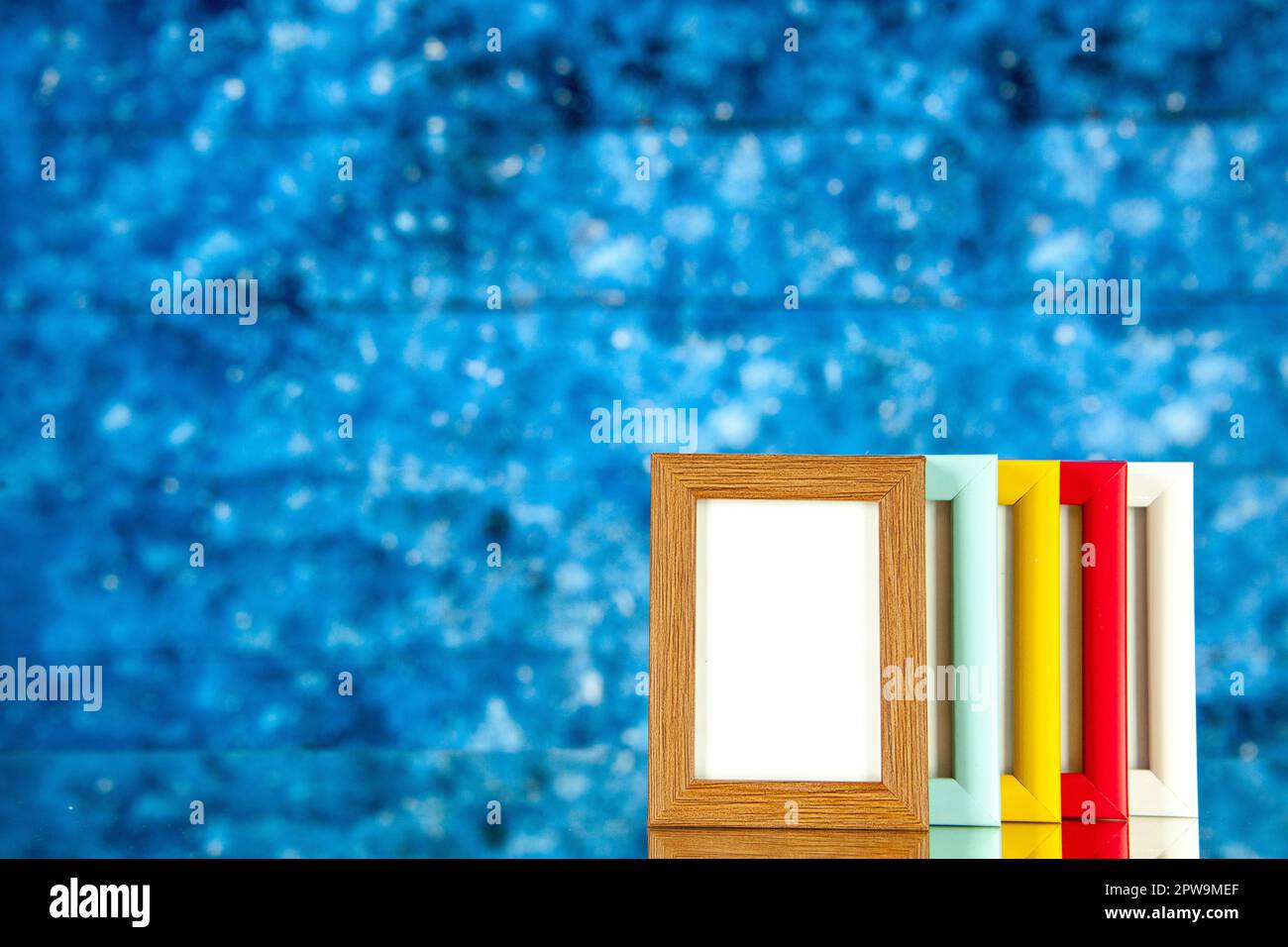 Side Colur Frame front view different picture frames with colored corners on blue ...