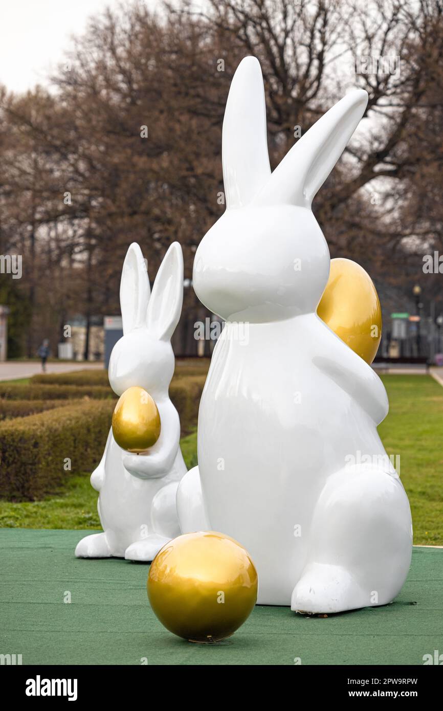 easter bunny holding an egg. easter bunny figure Stock Photo