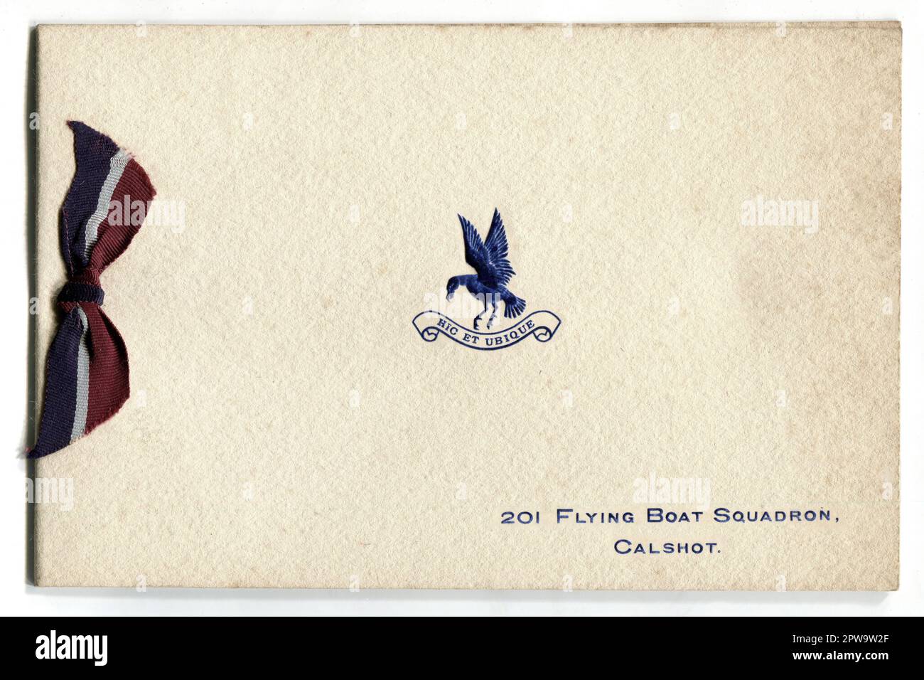A 1930s greetings card produced for members of 201 Flying Boat Squadron, Royal Air Force. The card is decorated with the squadron’s badge which consists of a seagull with the Latin motto, “Hic et Ubique” (Here and Everywhere). The card is bound with a ribbon in the colours of the RAF’s necktie.  The squadron was originally formed in October 1914 as No.1 Squadron of the Royal Naval Air Service. It was renumbered as 201 on the formation of the RAF on 1 April 1918 and disbanded in December 1919. It was reformed at RAF Calshot, Hampshire on 1 January 1929 as a flying boat unit. Stock Photo