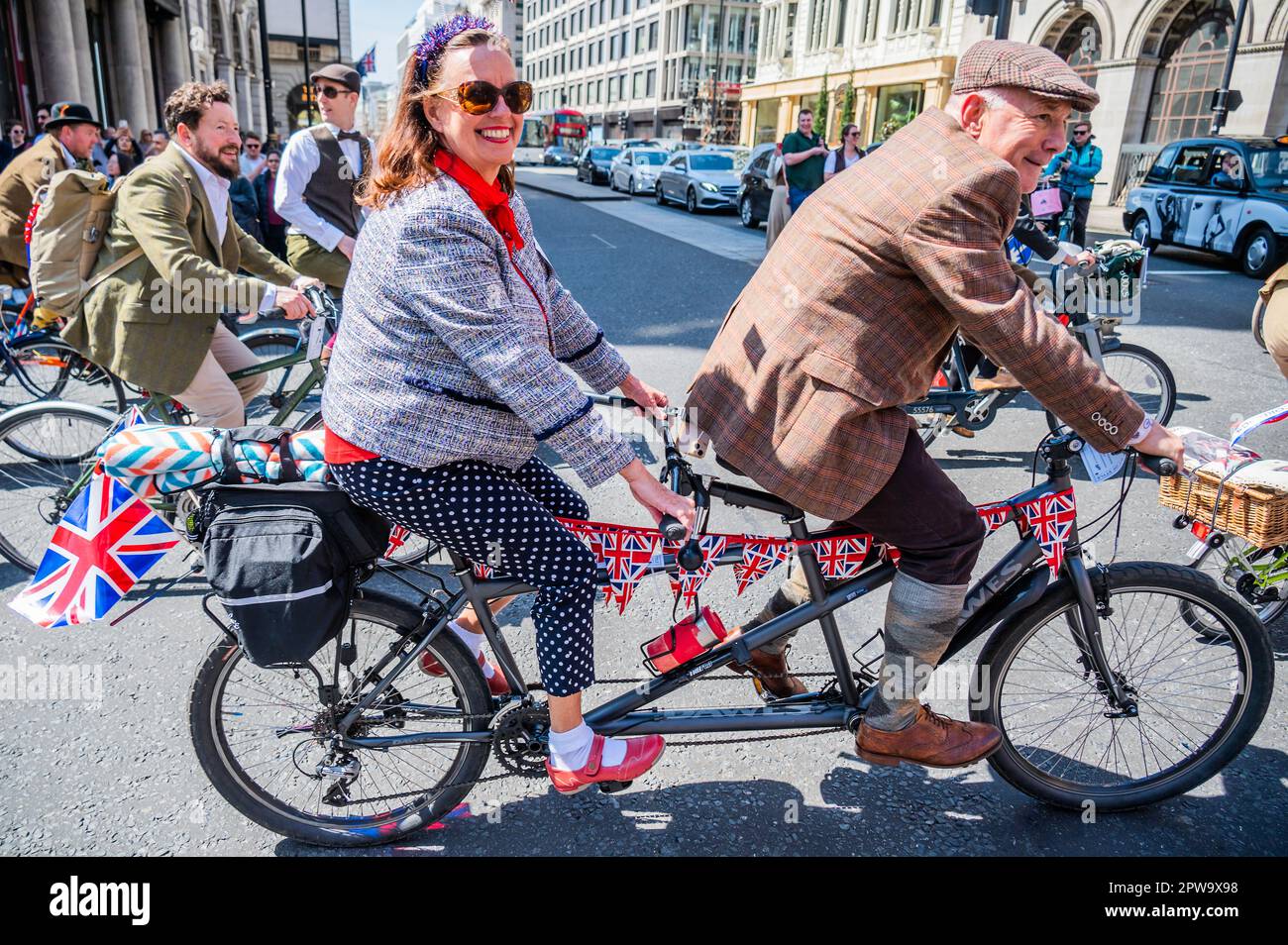 London, UK. 29th Apr, 2023. The Tweed Run London bike ride returns after a covid hiatus - passing through St James. Participants don their 'finest' tweeds and brogues and cycle through London, stopping along the way to take tea, have a picnic and ending with an 'old fashioned knees-up in the afternoon'. Credit: Guy Bell/Alamy Live News Stock Photo