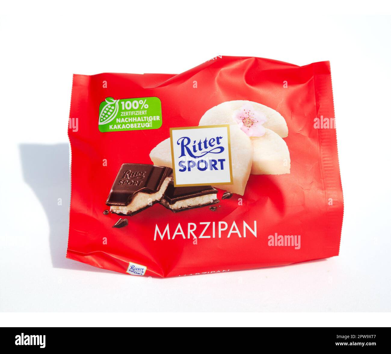 Ho Chi Minh City, Vietnam - March 28, 2023: Ritter Sport Marzipan chocolate bar empty crumpled wrapper isolated on white. Popular candy red packaging Stock Photo