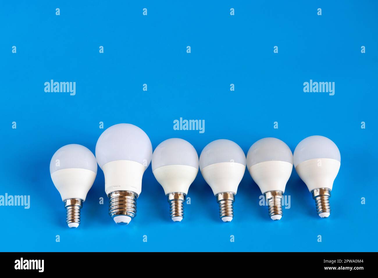 Energy-saving LED light bulbs on a blue background Stock Photo