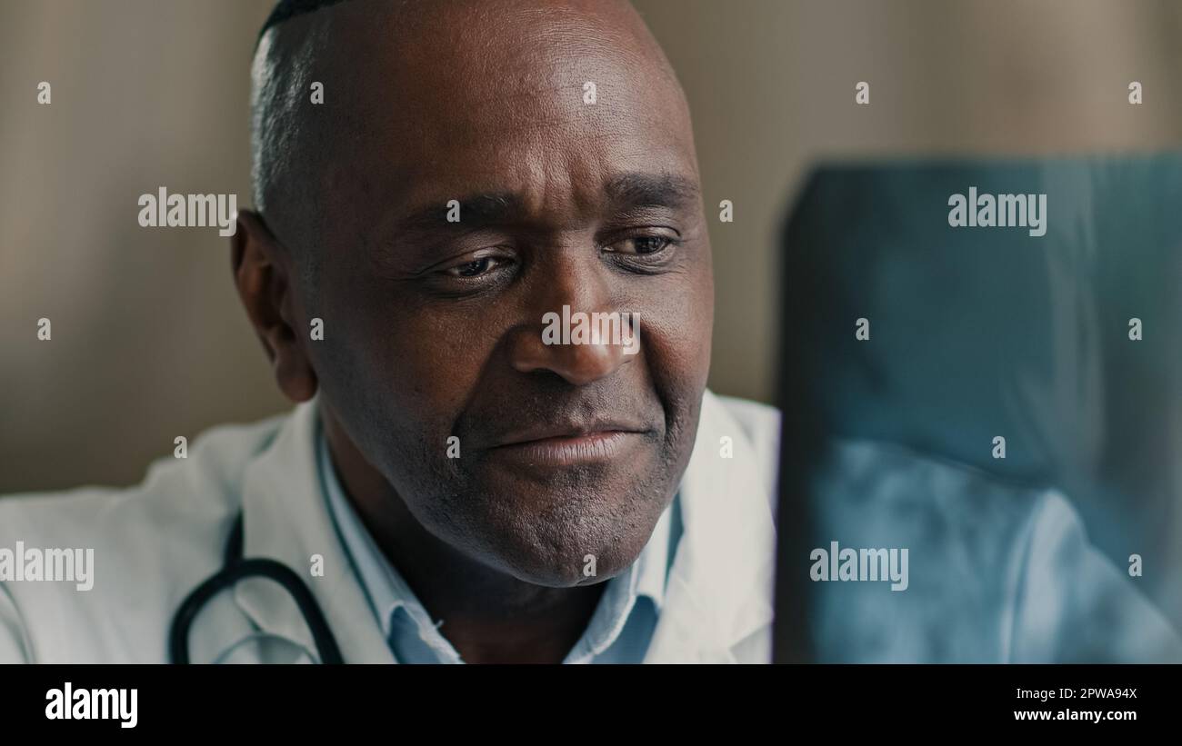 Doctor man radiologist medical professor scanning MRI image checking