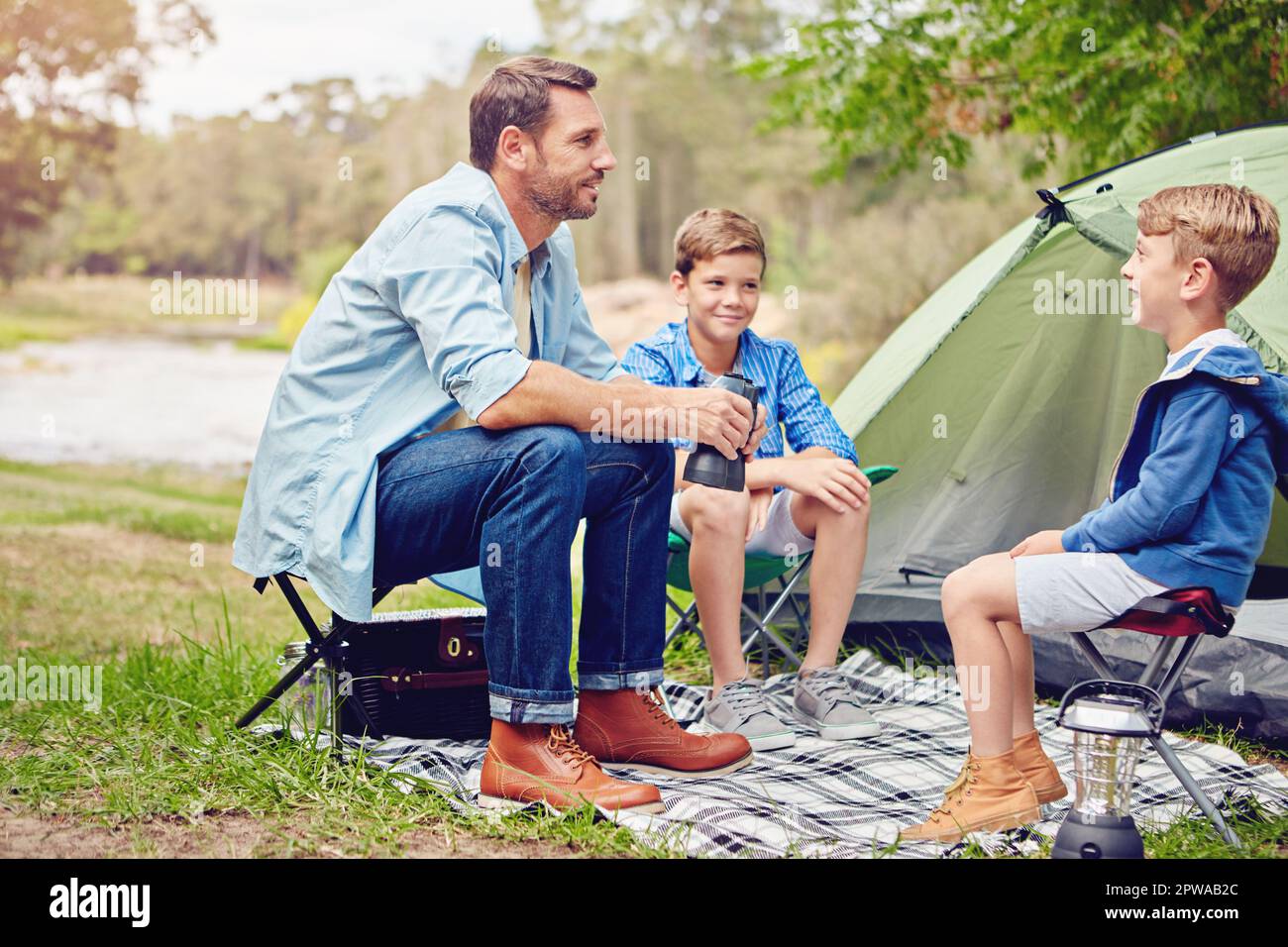 camping-with-his-boys-a-father-and-his-two-sons-out-camping-in-the