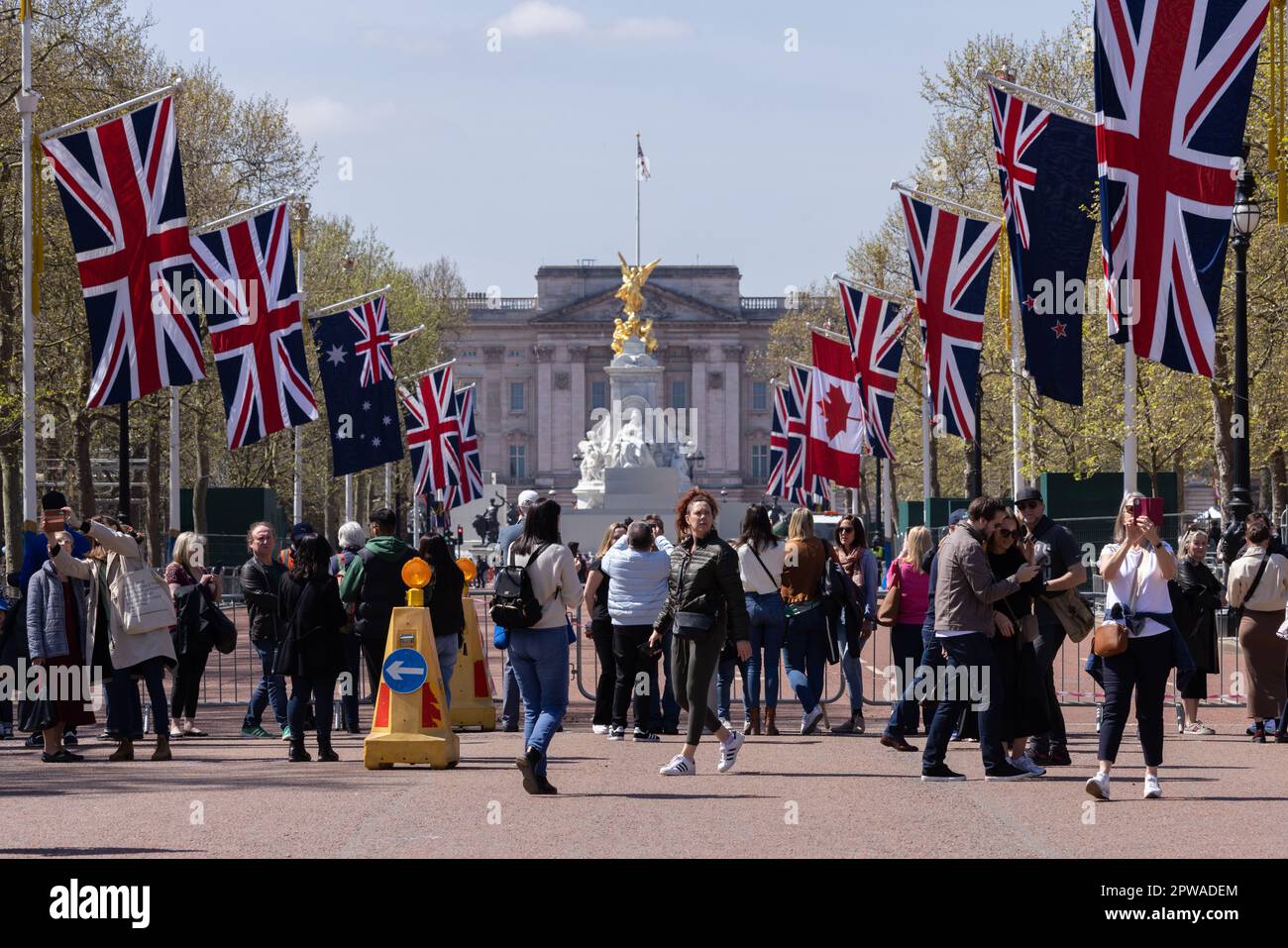 Tourists gather along The Mall to enjoy the build up and preparations in london ahead of the Coronation of King Charles III, London, England, UK Stock Photo