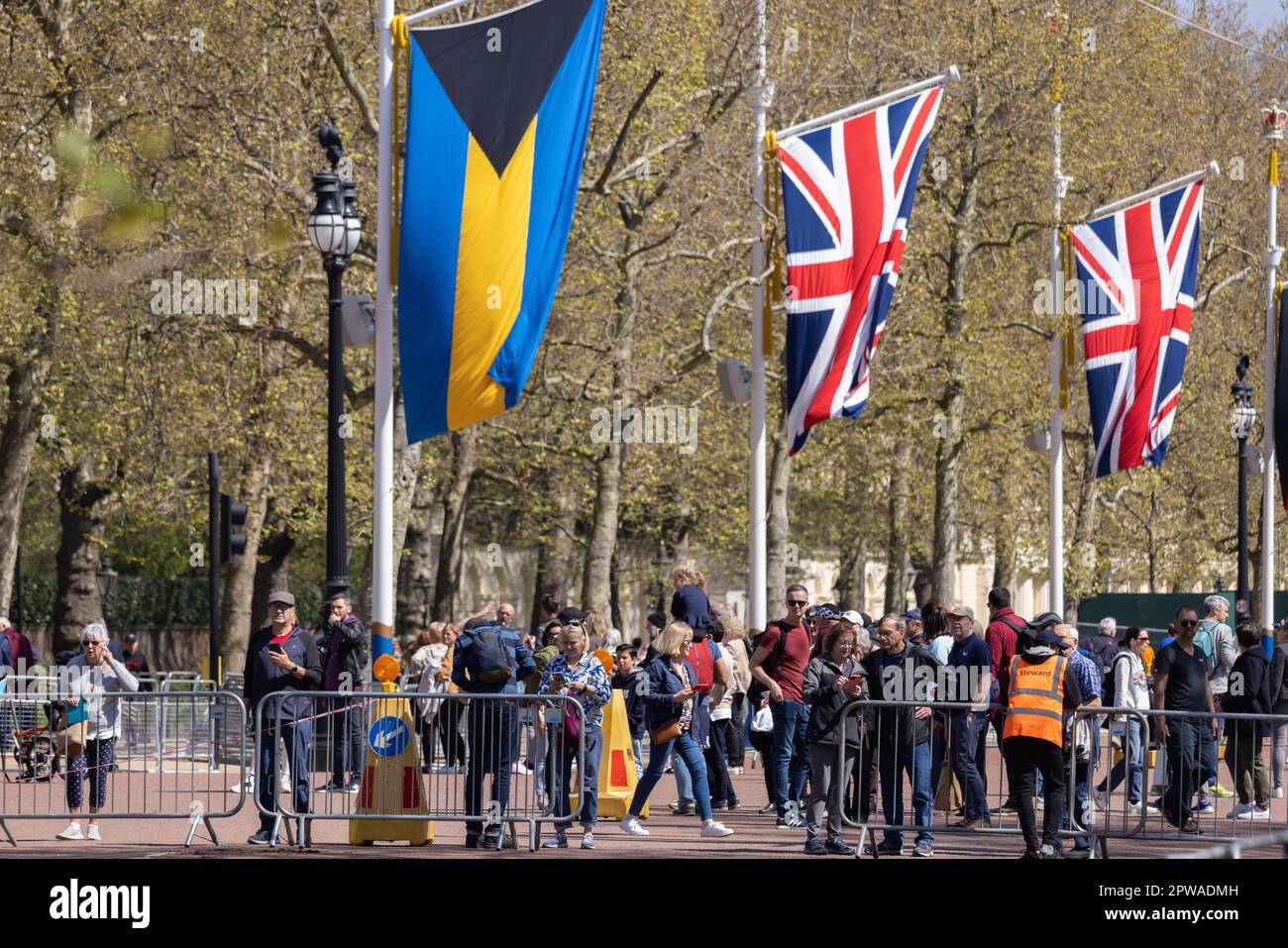 Tourists gather along The Mall to enjoy the build up and preparations in london ahead of the Coronation of King Charles III, London, England, UK Stock Photo