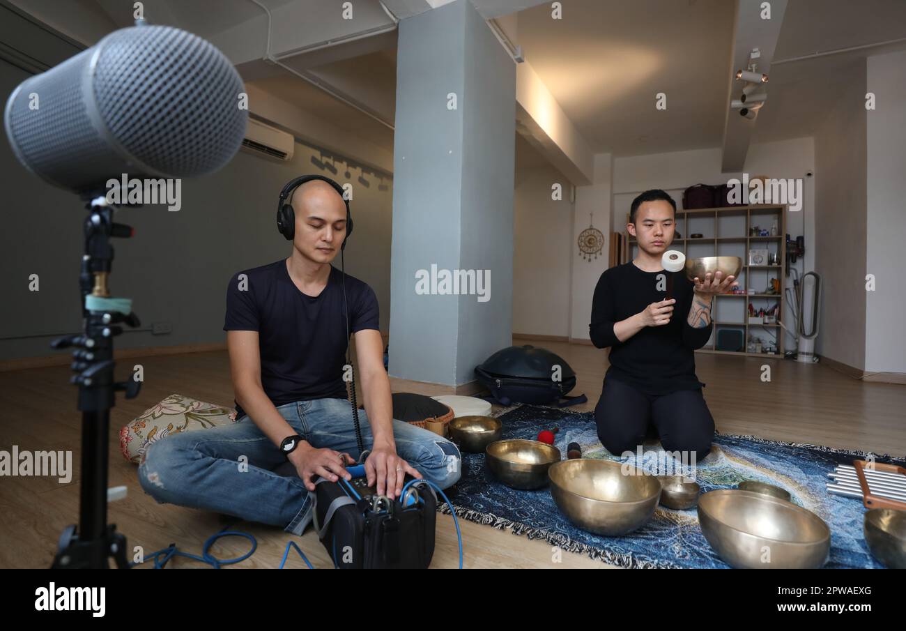 Sound recordist Terence LLoren (let) and sound bath practitioner Calvin ...