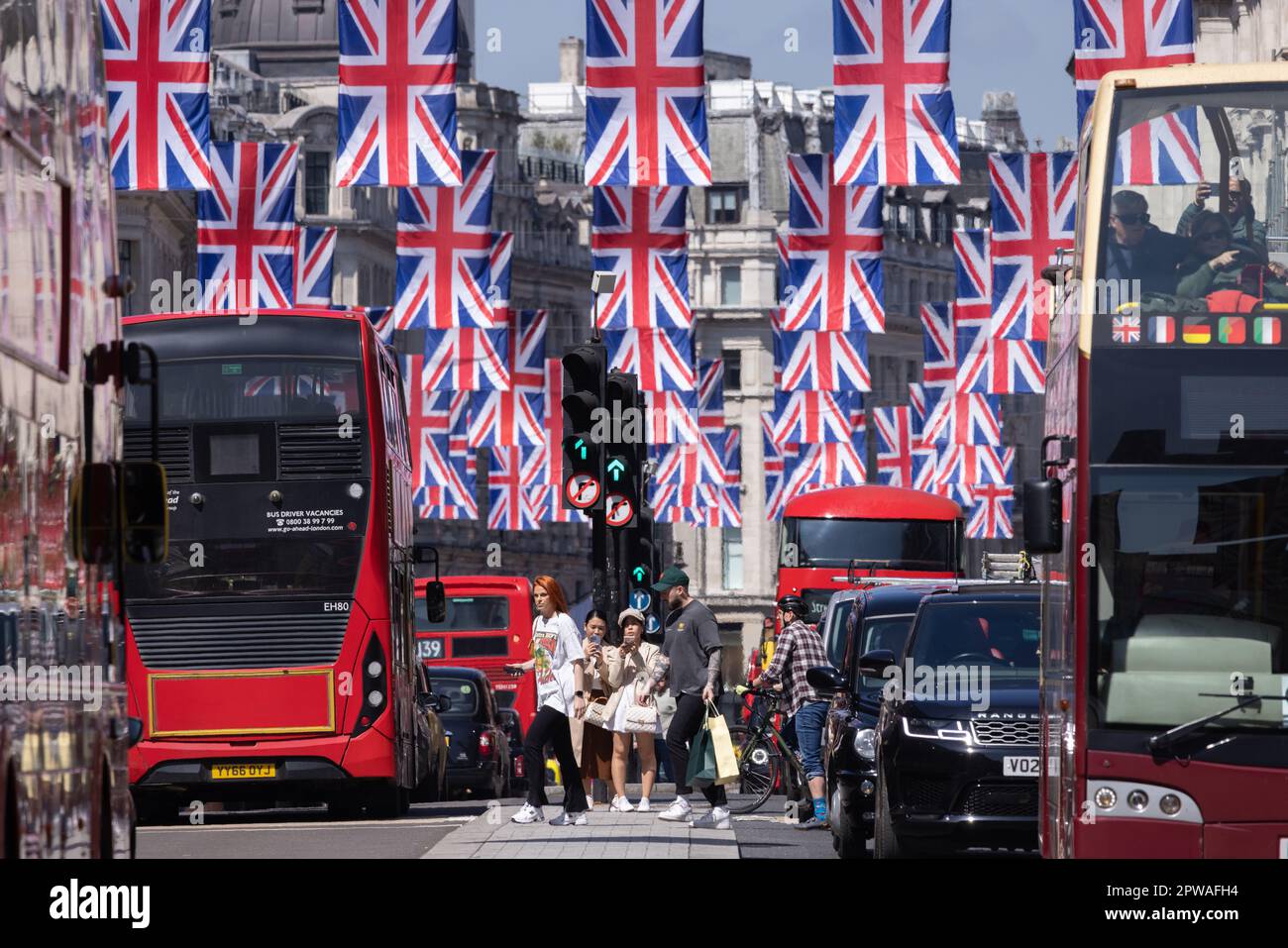 Union Jack flags hang along Regent Street ahead of the King Charles III Coronation on May 6th 2023, London, UK Stock Photo