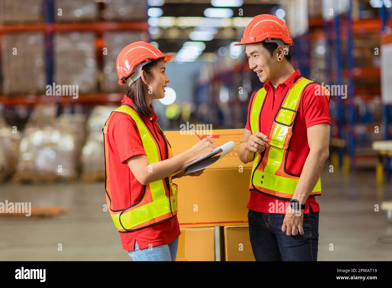 Asian factory warehouse staff worker enjoy working together. Cargo inventory shipping logistics